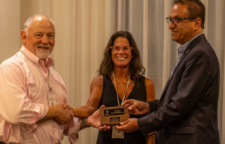 Asa Trainer receives Brad Rigdon award from PDES General Manager Allison Barnard Feeney, CEO and Board President Dr. Michael Jahadi of Lockheed Martin Company